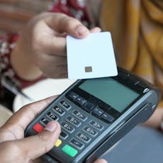 Card tapping a payment terminal Card tapping a payment terminal